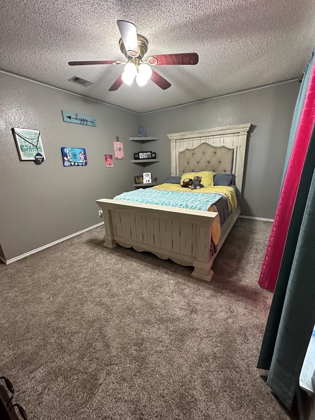 bedroom with dark colored carpet, ceiling fan, and a textured ceiling