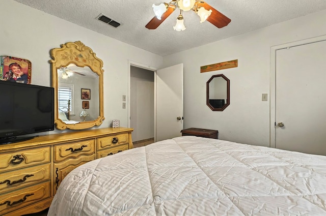 3013 Whittle Way, Midland, TX 79707 - bedroom featuring a textured ceiling and a ceiling fan