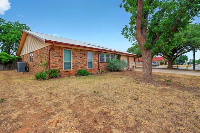 3013 Whittle Way, Midland, TX 79707 - single story home featuring a garage, brick siding, driveway, and cooling unit