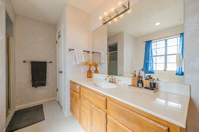 bathroom with vanity and an enclosed shower