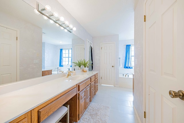 bathroom with vanity, a bath, and tile patterned floors