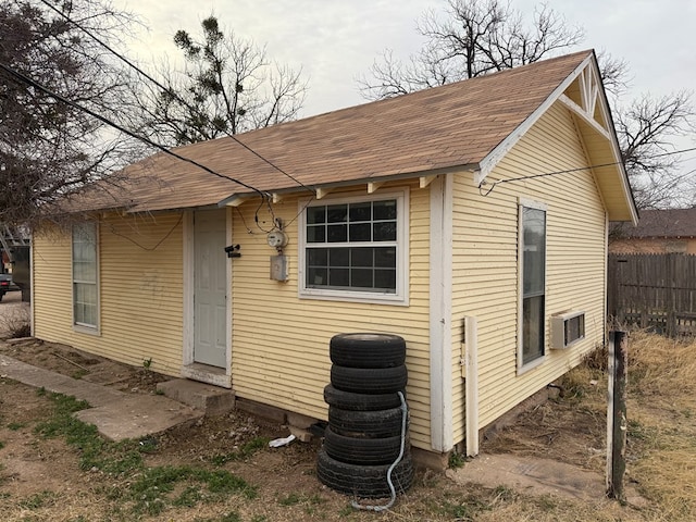 view of outdoor structure with fence