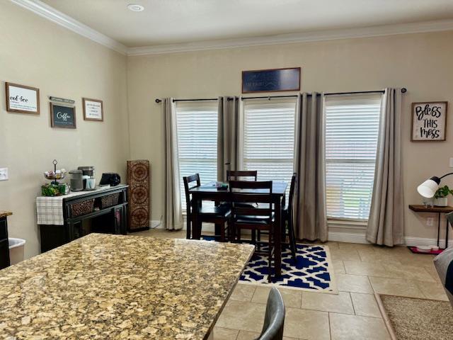 1406 Wrangler Ln, Midland, TX 79705 - dining room featuring crown molding and baseboards