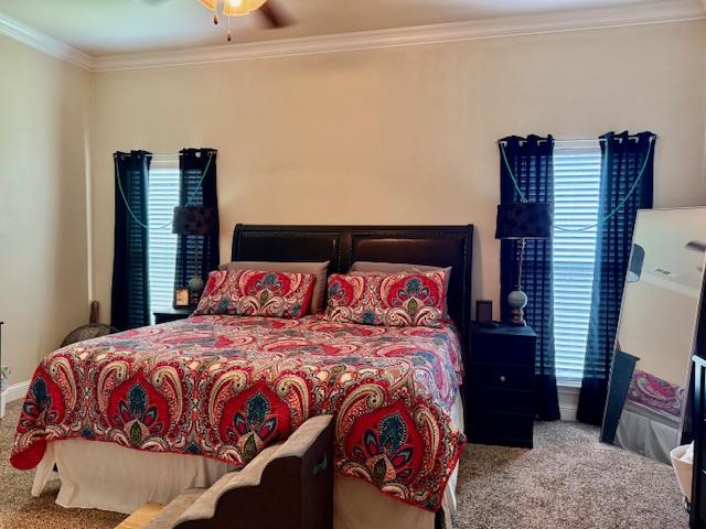 1406 Wrangler Ln, Midland, TX 79705 - bedroom featuring carpet flooring, crown molding, and ceiling fan