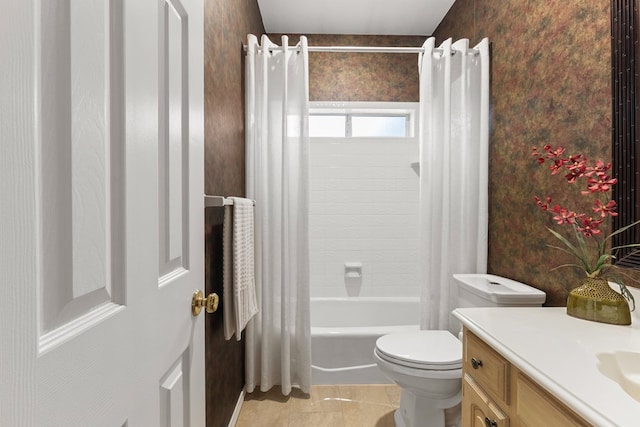 bathroom featuring toilet, vanity, shower / bath combo, and wallpapered walls