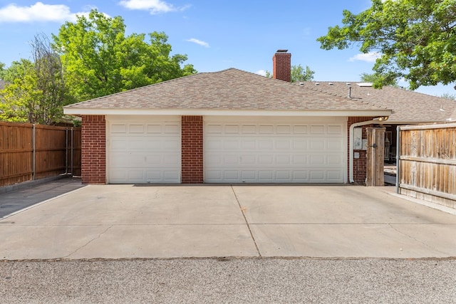 garage with fence
