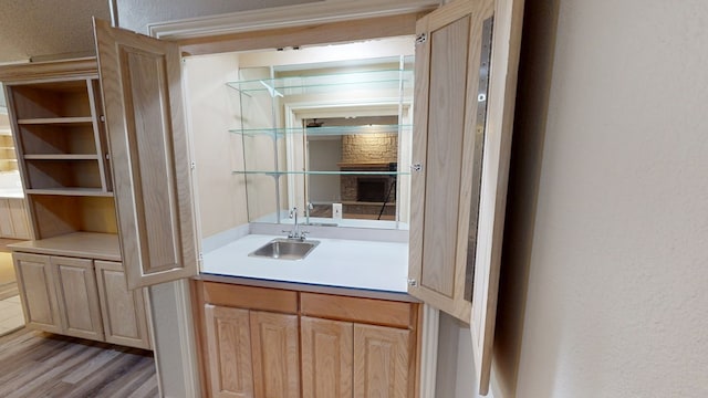 3608 Apollo Ct, Midland, TX 79707 - bar featuring a sink and light wood-style flooring