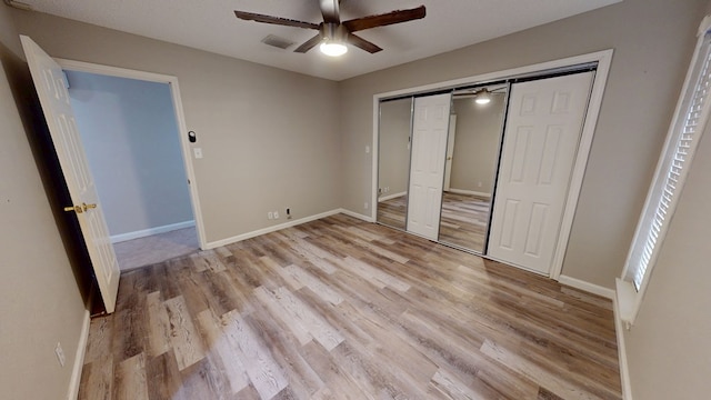 3608 Apollo Ct, Midland, TX 79707 - unfurnished bedroom featuring light wood-style flooring, a closet, and baseboards