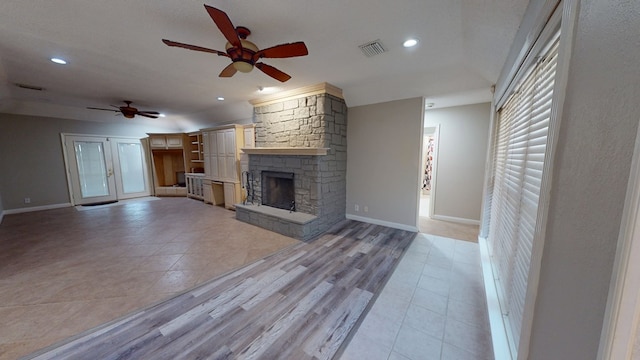 3608 Apollo Ct, Midland, TX 79707 - unfurnished living room with ceiling fan, baseboards, a fireplace, light tile patterned floors, and recessed lighting