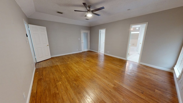 3608 Apollo Ct, Midland, TX 79707 - empty room with ceiling fan, light wood-style flooring, baseboards, and a textured ceiling