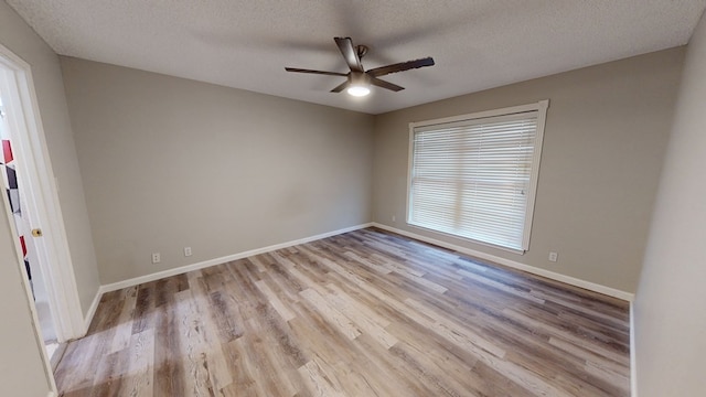 3608 Apollo Ct, Midland, TX 79707 - spare room featuring ceiling fan, light wood-type flooring, a textured ceiling, and baseboards