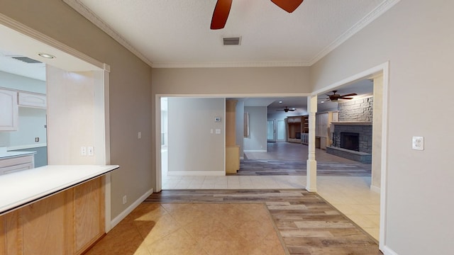 3608 Apollo Ct, Midland, TX 79707 - hall with crown molding, light tile patterned flooring, and a textured ceiling