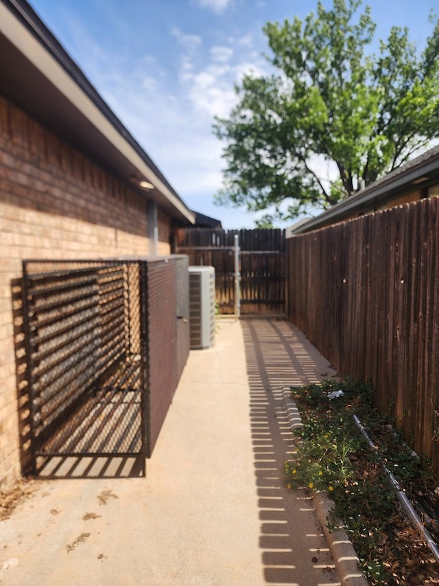 3608 Apollo Ct, Midland, TX 79707 - view of patio / terrace with central air condition unit and a gate