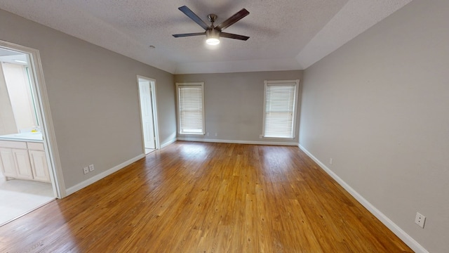 3608 Apollo Ct, Midland, TX 79707 - spare room featuring a ceiling fan, light wood-type flooring, baseboards, and a textured ceiling