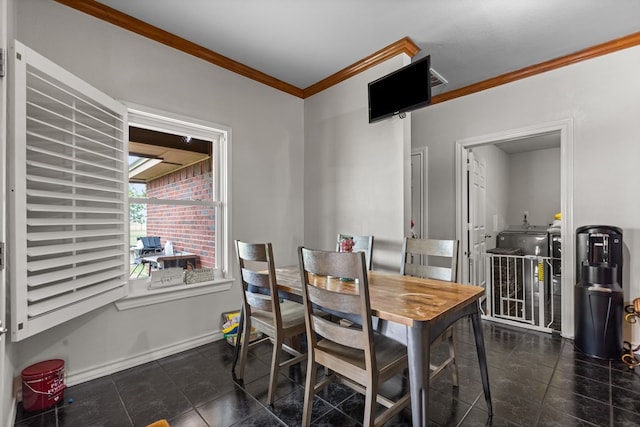 tiled dining room with ornamental molding