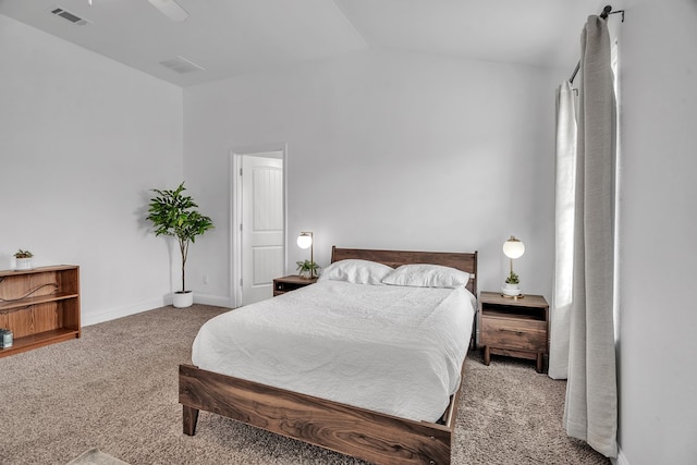 bedroom featuring carpet floors, vaulted ceiling, ceiling fan, and baseboards