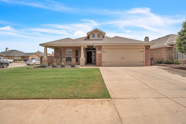 view of front of home featuring brick siding, a front lawn, a garage, driveway, and a shingled roof