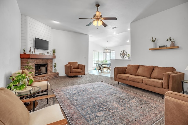 living room with lofted ceiling, a ceiling fan, a fireplace, a chandelier, and baseboards