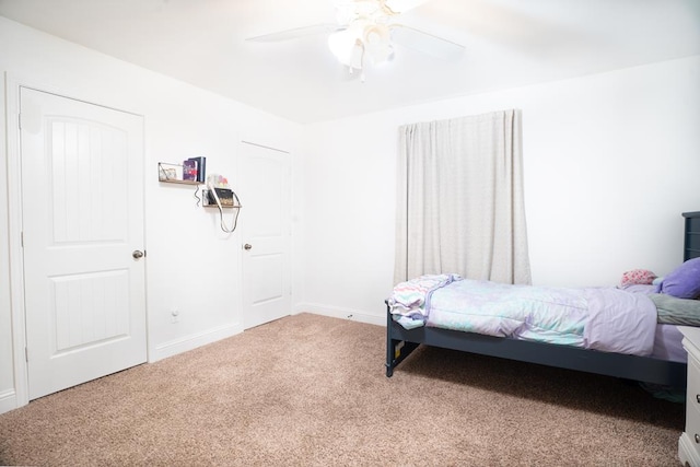 bedroom featuring carpet, ceiling fan, and baseboards