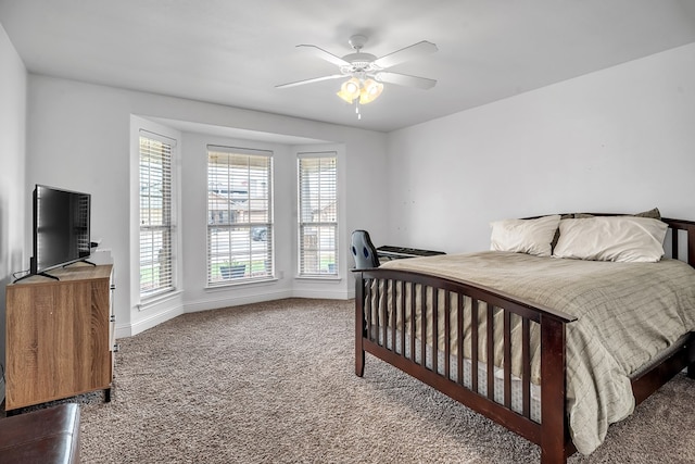 carpeted bedroom with baseboards and ceiling fan