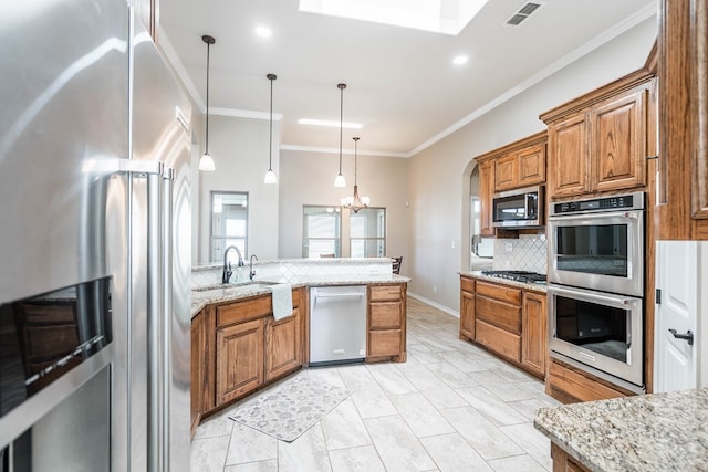 kitchen featuring visible vents, brown cabinets, decorative light fixtures, light stone countertops, and stainless steel appliances