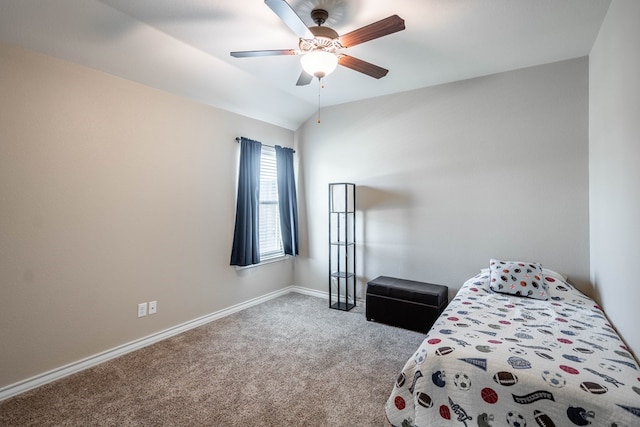 bedroom with lofted ceiling, ceiling fan, light carpet, and baseboards