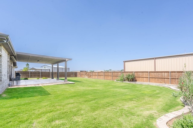 view of yard featuring a patio area and a fenced backyard