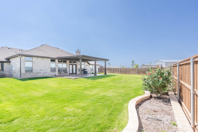 view of yard featuring a fenced backyard, a patio, and a pergola