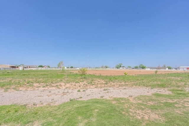 view of yard with a rural view