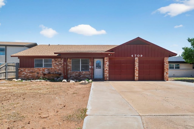 4709 Shadylane Dr, Midland, TX 79703 - ranch-style house featuring a garage, brick siding, board and batten siding, roof with shingles, and concrete driveway