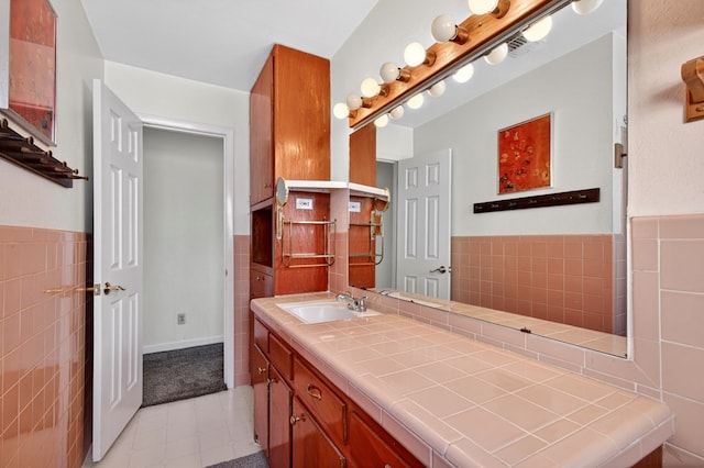 4709 Shadylane Dr, Midland, TX 79703 - bathroom with tile walls, vanity, tile patterned flooring, and a wainscoted wall