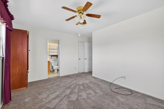 4709 Shadylane Dr, Midland, TX 79703 - unfurnished bedroom with carpet flooring, ensuite bathroom, baseboards, and a ceiling fan