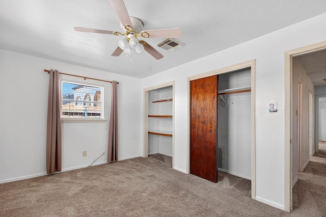 4709 Shadylane Dr, Midland, TX 79703 - unfurnished bedroom featuring carpet floors, multiple closets, ceiling fan, and baseboards