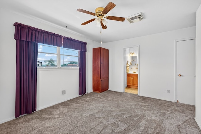 4709 Shadylane Dr, Midland, TX 79703 - unfurnished bedroom with light carpet, connected bathroom, ceiling fan, and baseboards