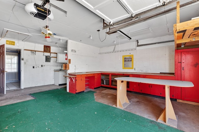 4709 Shadylane Dr, Midland, TX 79703 - garage with a workshop area, a garage door opener, and electric panel
