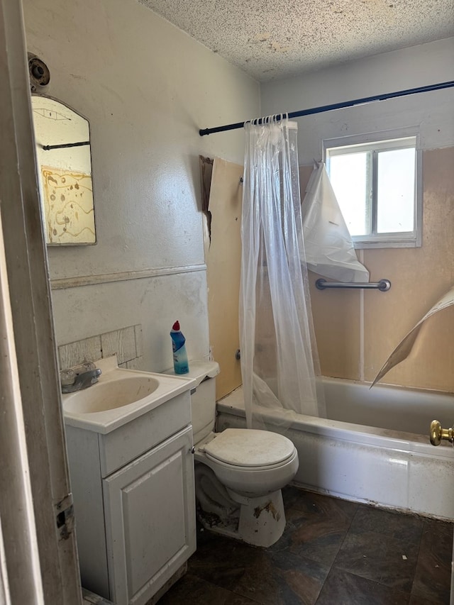 full bathroom with toilet, shower / tub combo, a textured ceiling, and vanity