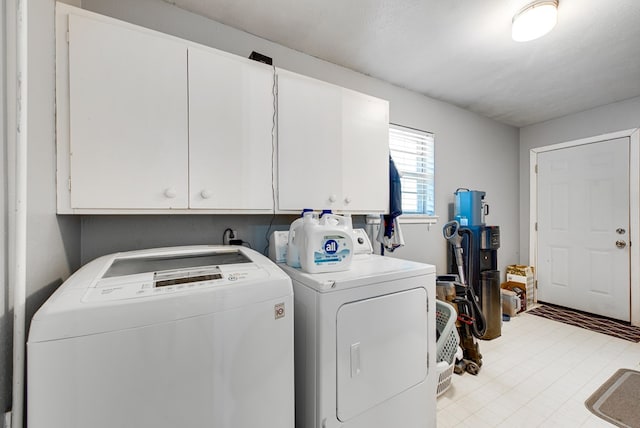 2817 W Shandon Ave, Midland, TX 79705 - laundry area featuring cabinet space and separate washer and dryer