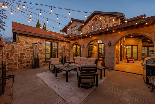 patio terrace at dusk with outdoor lounge area