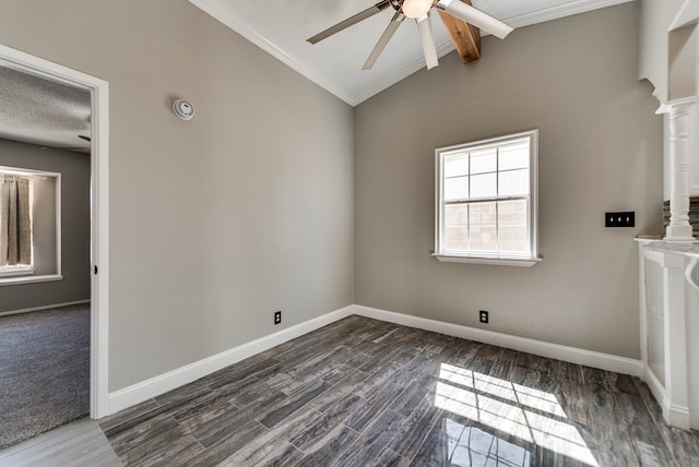 unfurnished room featuring a ceiling fan, dark wood-style floors, baseboards, ornamental molding, and decorative columns