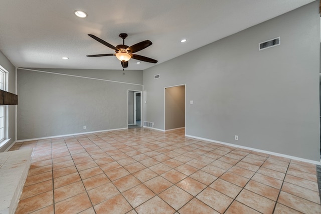 empty room featuring lofted ceiling, ceiling fan, recessed lighting, and light tile patterned floors