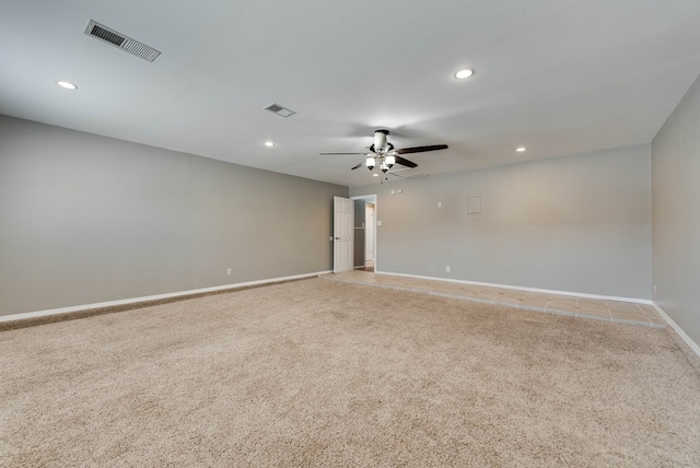 unfurnished room with light carpet, recessed lighting, baseboards, and a ceiling fan
