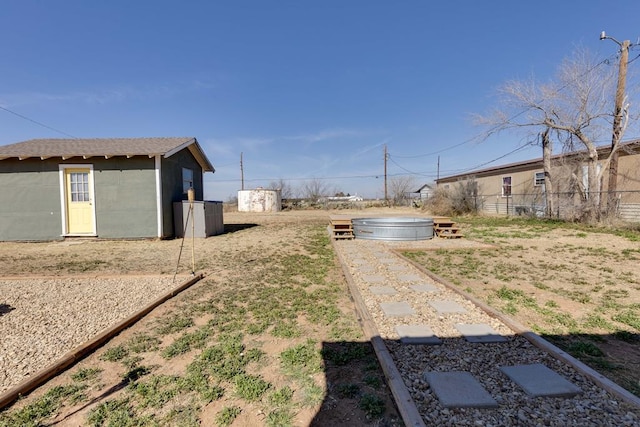 view of yard with a storage unit