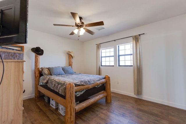 bedroom featuring dark hardwood / wood-style floors and ceiling fan