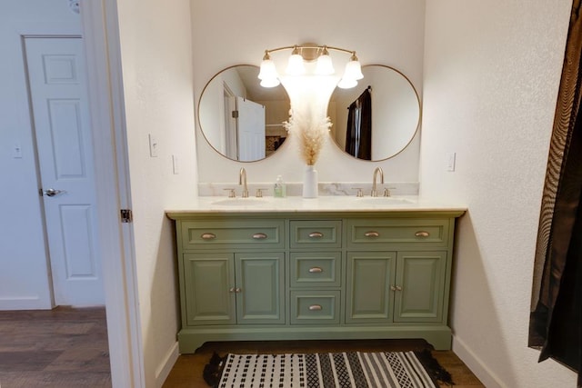 bathroom featuring hardwood / wood-style flooring and vanity