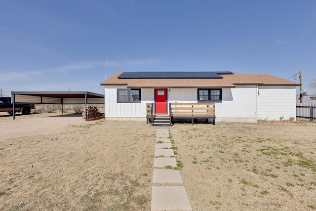 view of front of home featuring a carport