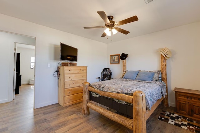 bedroom featuring wood-type flooring and ceiling fan