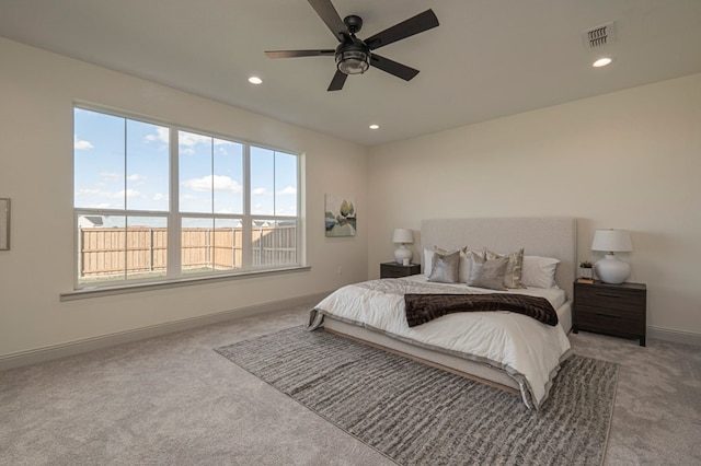 bedroom featuring ceiling fan and light colored carpet