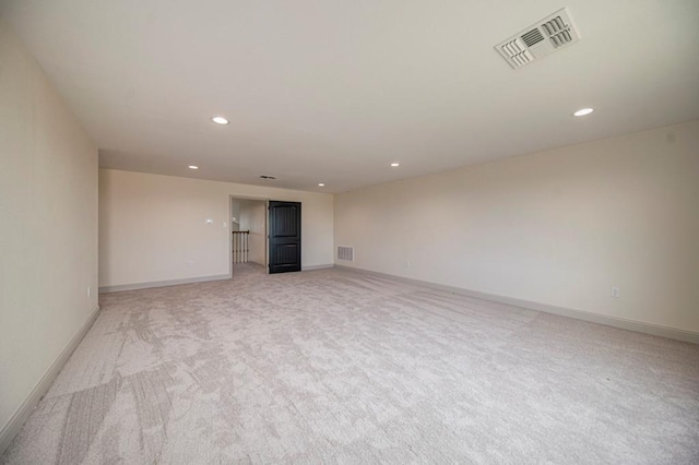 empty room with light colored carpet