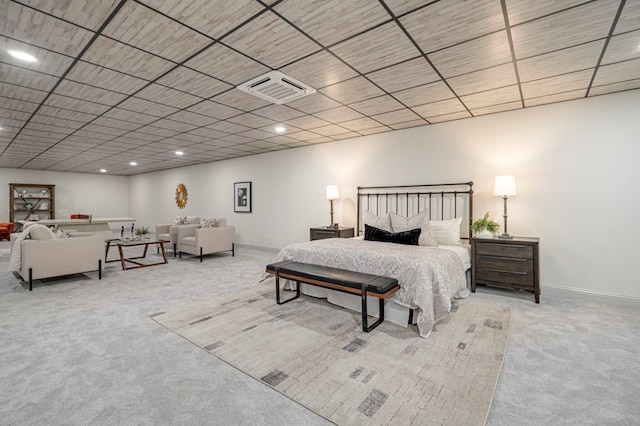 bedroom featuring light carpet