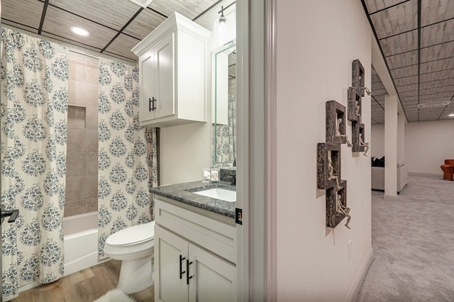 full bathroom featuring toilet, vanity, and shower / tub combo with curtain